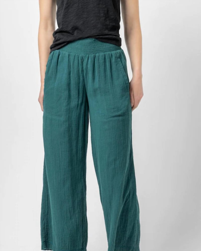 Front of a model wearing a size L Gauze Smocked Waist Pant in Sea Moss in Sea Moss by Lilla P. | dia_product_style_image_id:343396